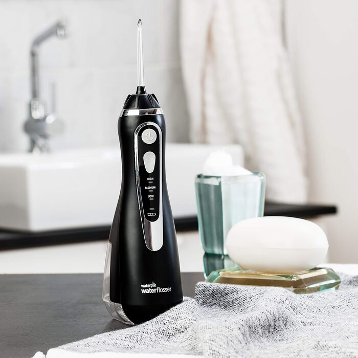 Акумуляторний іригатор для порожнини рота Waterpik Cordless Advanced Waterflosser з 4 насадками, діапазон тиску від 3.1 до 5.2 регулюється за допомогою 3 налаштувань тиску, з індукційною системою зарядки, чорний (WP-562EU), 1 упаковка